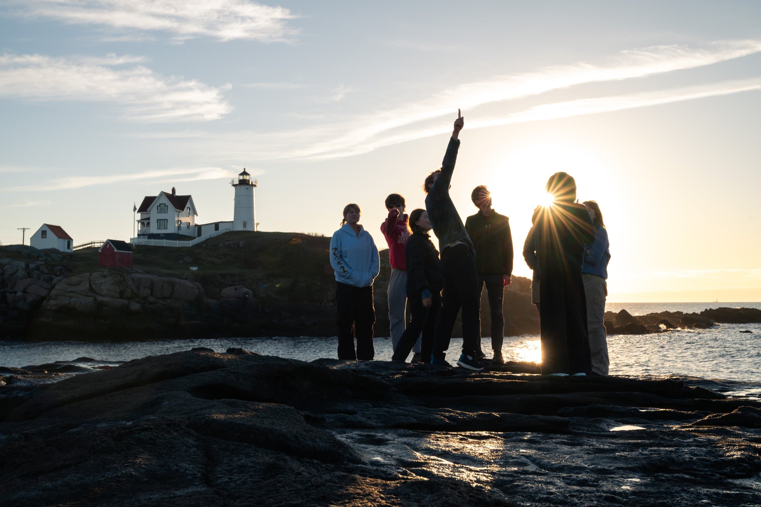 Members at the coast at sunset