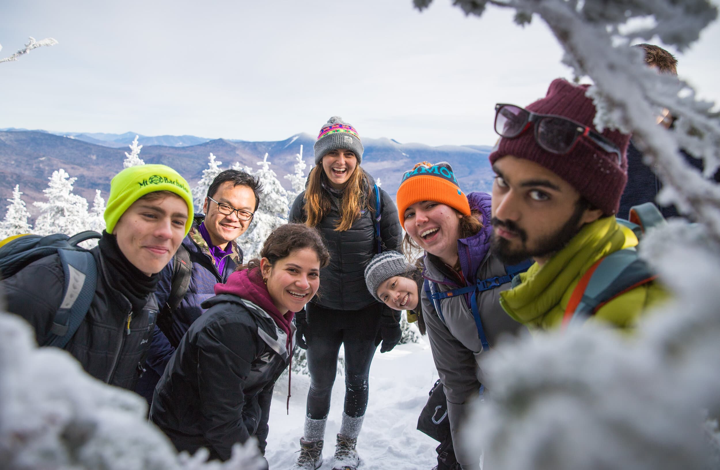 Smiling members in winter gear