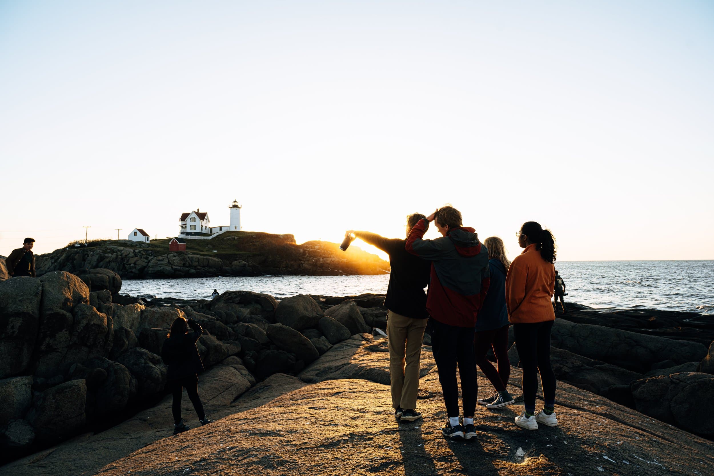 Members at the coast at sunset